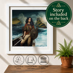 A framed art print featuring a Viking woman in a boat on a dramatic sea scene, displayed on a tabletop with a potted fern and decorative icons. A green circular badge reads 'Story included on the back'.